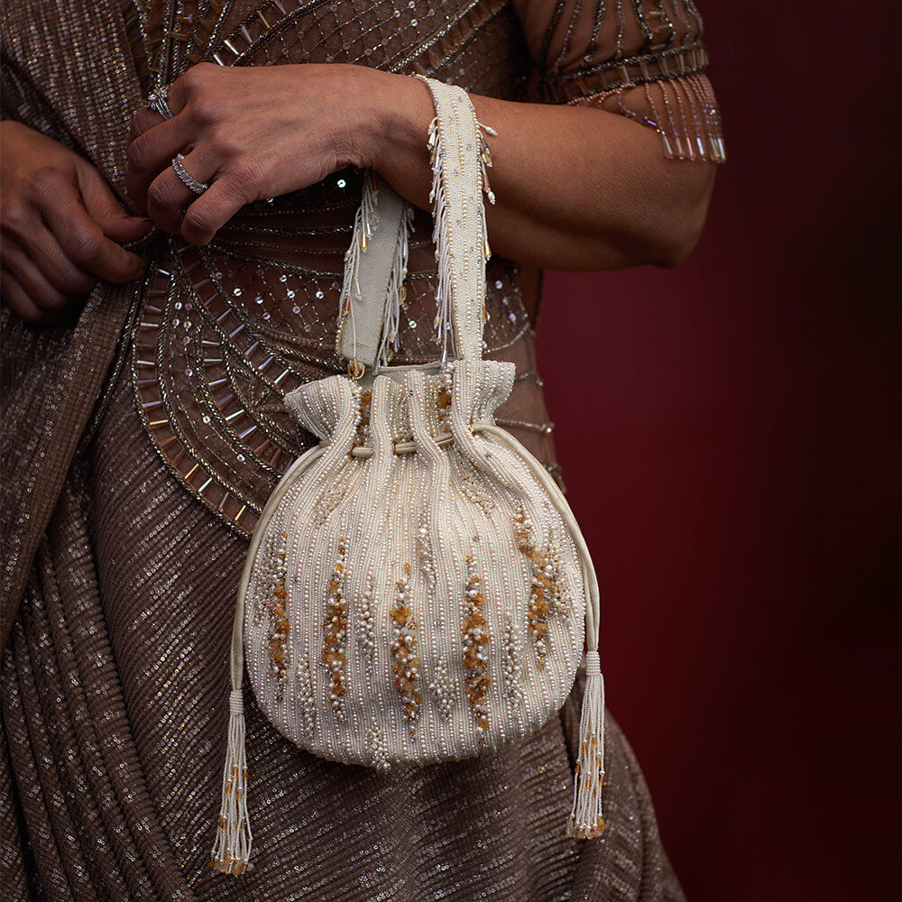 Nora Potli Pristine Ivory Peerless Gold Lustrous Silver With Handle